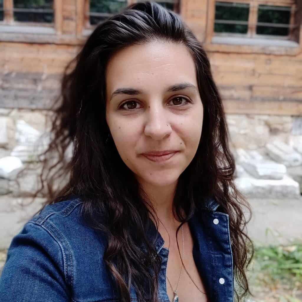 Image of Kelly in front of ancient ruins in Bulgaria