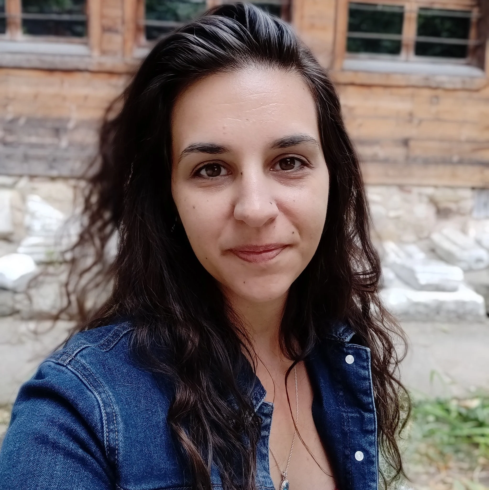 Image of Kelly in front of ancient ruins in Bulgaria